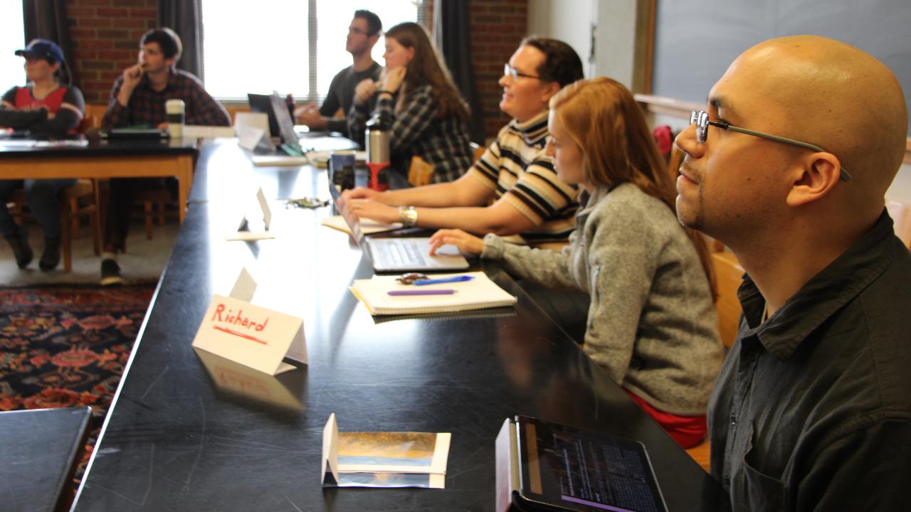 Graduate Students seated at tables