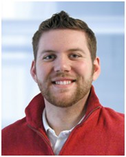 Photo of Keith wearing red sweater