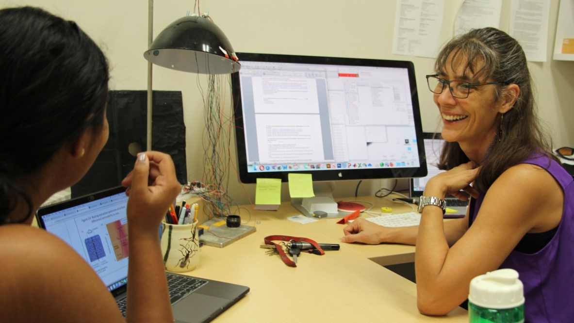 Professor and student working in an office