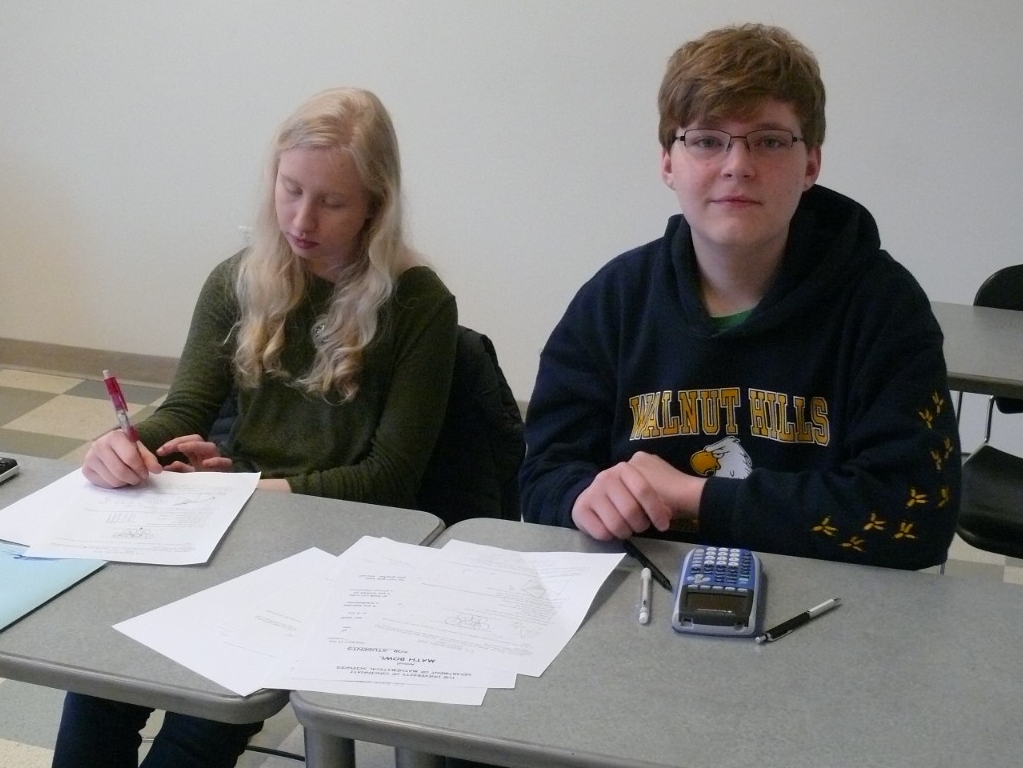 Math Bowl 2018 students working a grouped desks