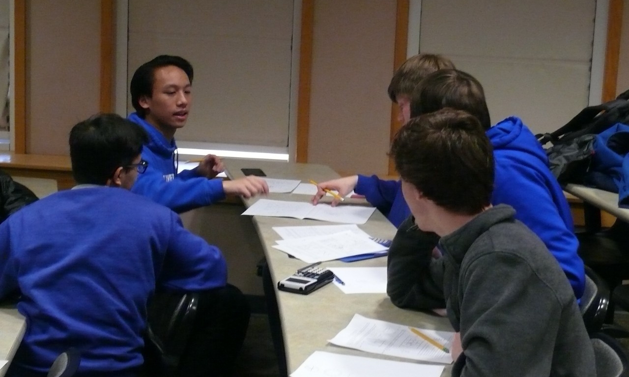 Math Bowl 2018 students working in a lecture hall