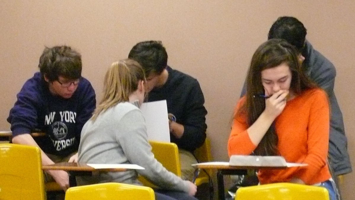 Math Bowl 2018 students working in a lecture hall