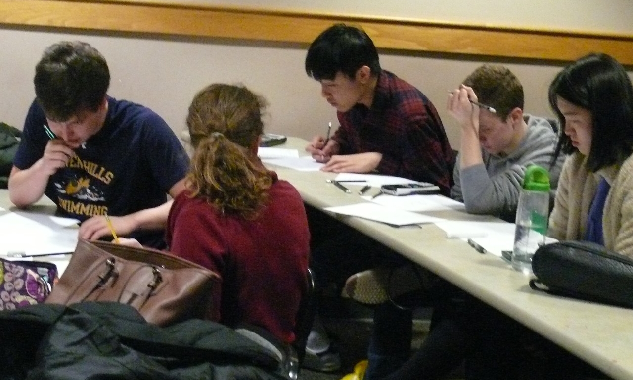 Math Bowl 2018 students working in a lecture hall