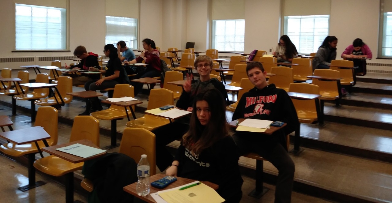 Math Bowl 2019 students working in a lecture hall
