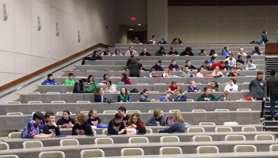 Math Bowl 2019 students working in a lecture hall