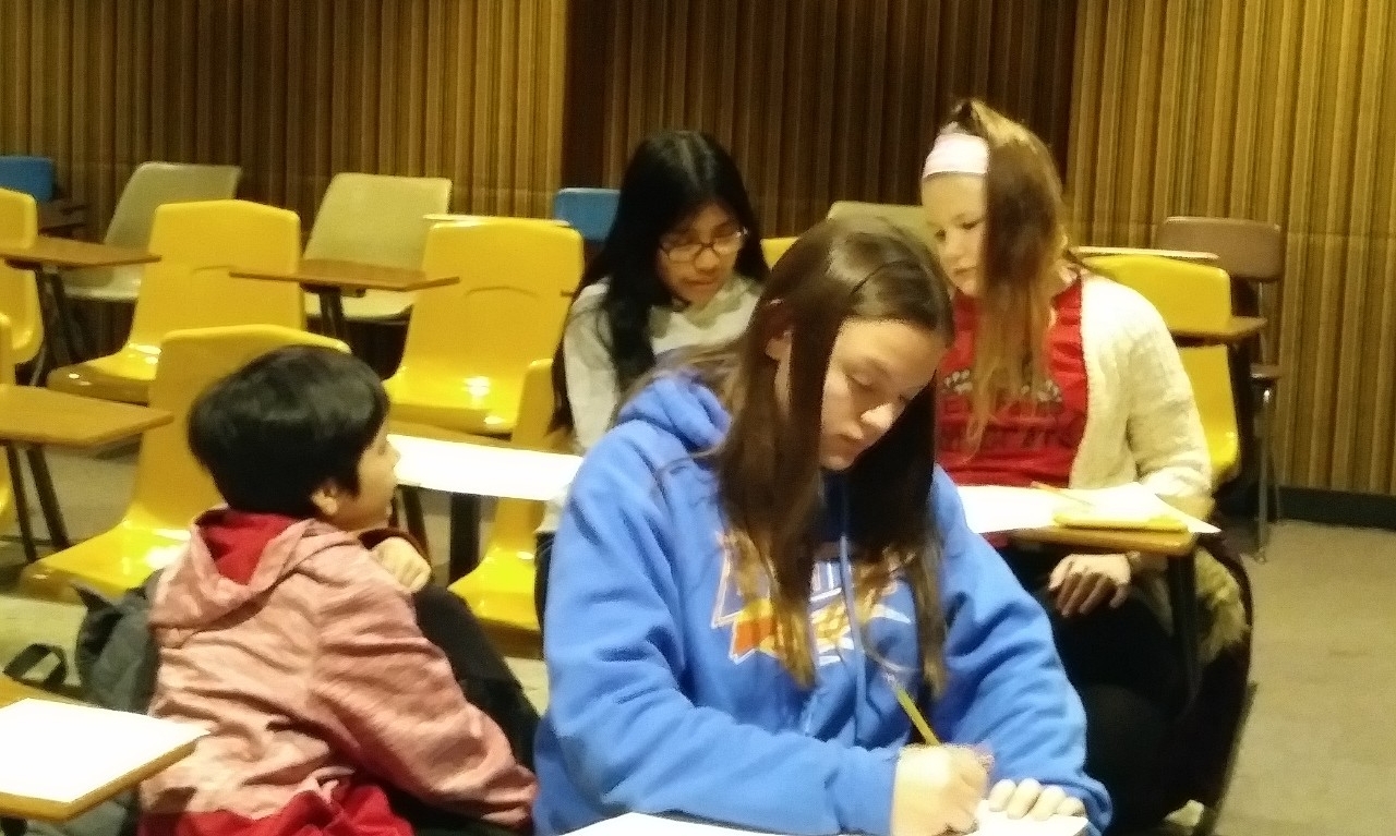Math Bowl 2019 students working in a lecture hall