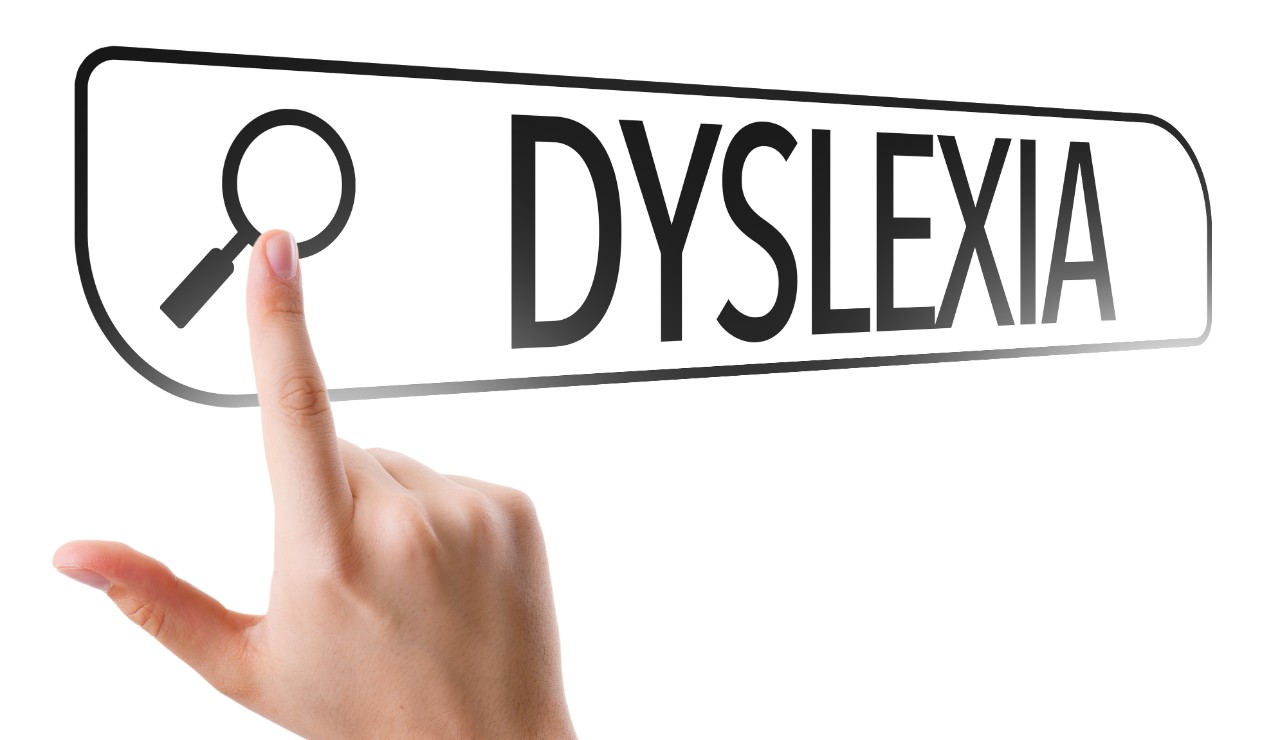 Finger clicking on the search box that has word Dyslexia written in it