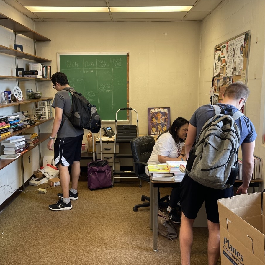 Students looking through books. 