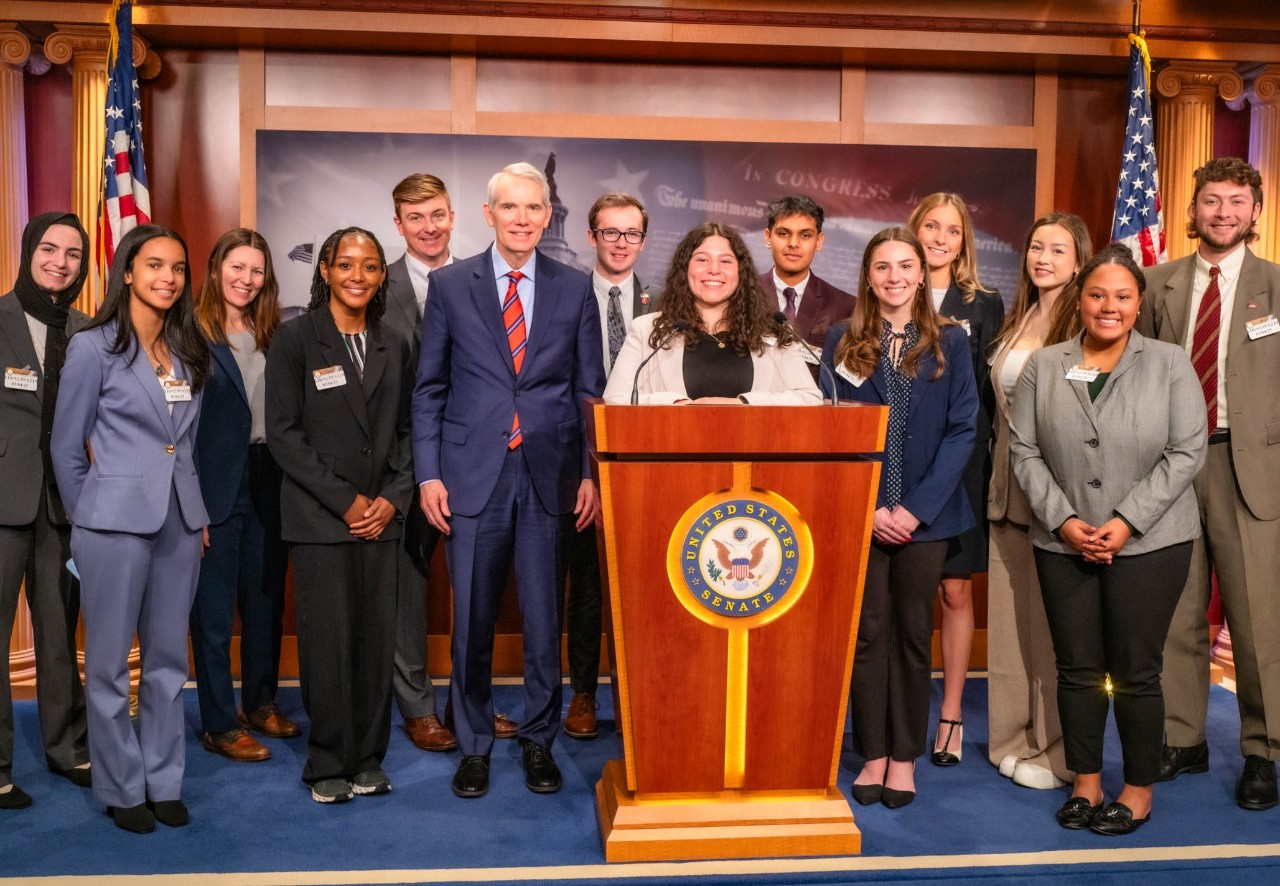 Students, Portman Center staff, and Senator Rob Portman pose for photo in Senate Press Room