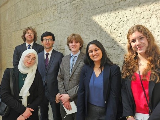 Undergraduate students pose in group
