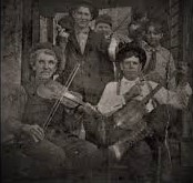 Black and white photo of performers with fiddles