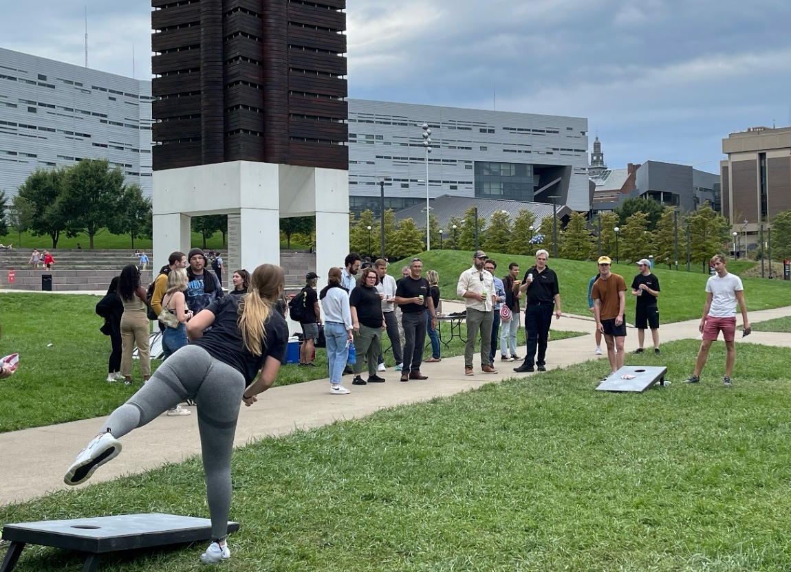 Mackenzie Collett tosses a beanbag