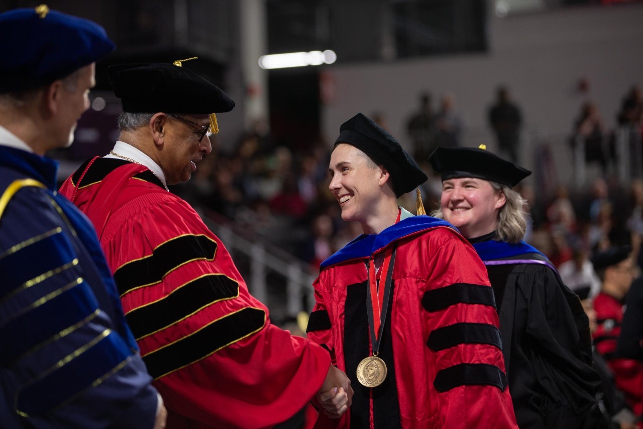 Student Jules Madzia with President Pinto